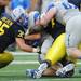 Michigan linebacker Joe Bolden helps take down Air Force full back Mike Dewitt during the second half at Michigan Stadium on Saturday. Melanie Maxwell I AnnArbor.com